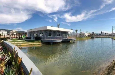 Terreno em condomínio fechado à venda na avenida deltaville, beira rio, biguaçu, 150 m2 por r$ 220.000