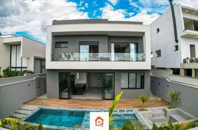 Casa assobradada de alto padrão no vila paradiso – 3 suítes, piscina com hidro, gourmet completo e paisagismo tropical