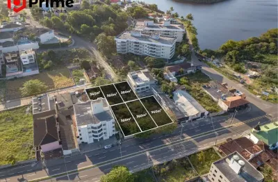 Terreno residencial e comercial à venda na enseada azul de frente para rodovia.
