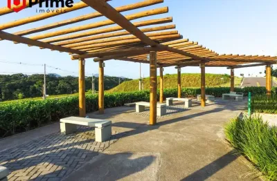 Lote à venda em condomínio fechado com beach clube exclusivo de frente para a praia de peracanga em guarapari/es.