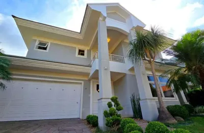 Casa no condomínio vivendas do parque iv a venda no bairro nossa senhora das graças em canoas - três suítes, piscina.