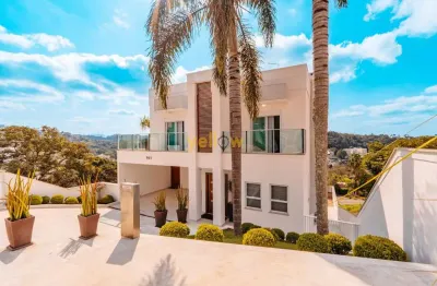 Casa luxuosa em arujá: 4 suítes em condomínio hills iii