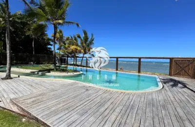 Casas pé na areia a venda em arraial ' d ajuda em condominio fechado