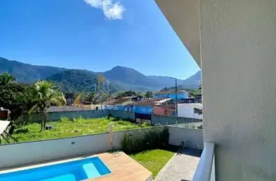 Casa nova com piscina a 300 metros da praia do massaguaçu