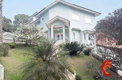 Oportunidade no arujá hills: casa de 500m², 4 dormitórios e lareira por r$3.200.000