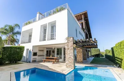 Casa em condomínio fechado com 6 quartos à venda na Rodovia Jornalista Manoel de Menezes, 2129, Barra da Lagoa, Florianópolis