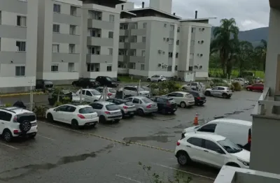 Lindo apartamento na regiao de biguacú, com 2 quartos e vaga de garagem.
