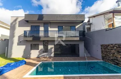 Casa térrea com jardim + piscina aquecida, 3 suítes, 4 vagas à venda – mossunguê - curitiba/pr