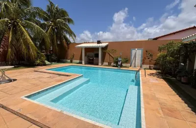 Casa em condomínio no litoral norte, beira da praia e perto do rio