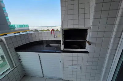 Prédio frente mar com sacada gourmet e churrasqueira carvão.