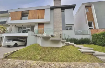 Casa em condomínio fechado com 4 quartos à venda na avenida edgar pires de castro, 1780, hípica, porto alegre, 488 m2 por r$ 3.180.000