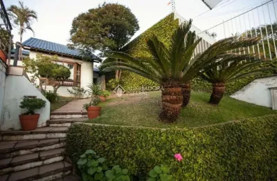Casa com 5 quartos à venda na rua mozart, 134, três figueiras, porto alegre, 300 m2 por r$ 1.900.000