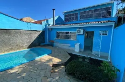 Casa com 2 quartos à venda na rua condores, 376, jardim algarve, alvorada, 164 m2 por r$ 500.000