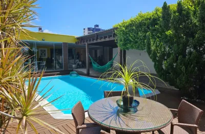 Casa 4 suítes, 399m², piscina e gourmet em capim macio — alto padrão