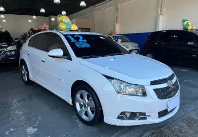 Gm cruze ltz 2012  sport 6 marchas, teto solar , bancos de couro,  km baixo  manual e chave reserva.