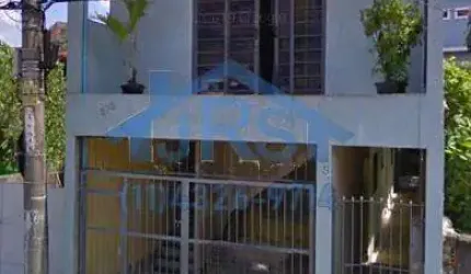 Terreno com 4 casas a venda