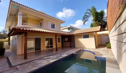 Luxuosa casa de alto padrão no Condomínio Manacás, Jardim Botânico, Ribeirão Preto-SP. 4 suítes, 516m², 6 vagas. Quer Imóvel Negócios Imobiliários.