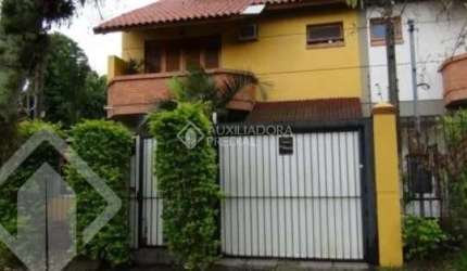 Casa em condomínio fechado com 3 quartos à venda na Rua Mura, 120, Guarujá, Porto Alegre, 154 m2 por R$ 600.000