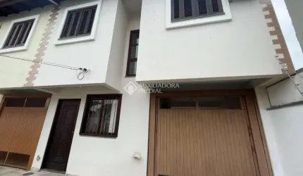 Casa em condomínio fechado com 3 quartos à venda na Rua Adão da Silva Santos, 230, São José, Canoas, 112 m2 por R$ 500.000