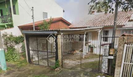 Casa em condomínio fechado com 3 quartos à venda na HENRIQUE MATIAS RIBEIRO, 883, Jardim Algarve, Alvorada, 85 m2 por R$ 200.000