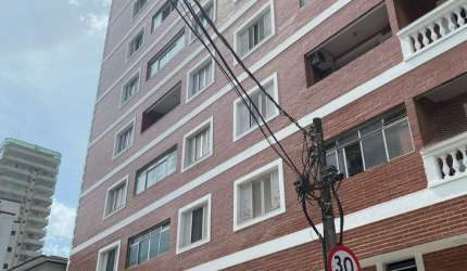 Apartamento em Praia Grande na Vila Tupi todo mobiliado à menos de 100 metros do mar documentação ok, aceita financiamento bancário.
