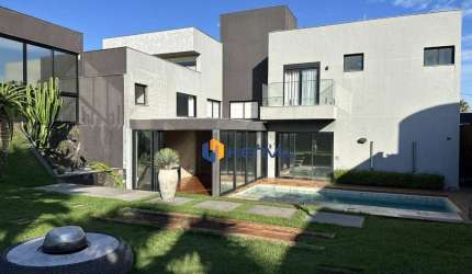 Casa com 5 suítes em condomínio à venda, 507 m² por R$ 5.500.000 - Chácaras Aeroporto - Maringá/PR