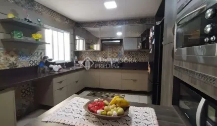 Casa em condomínio fechado com 4 quartos à venda na Rua Lindolfo Collor, 448, Morada do Vale III, Gravataí, 200 m2 por R$ 634.940