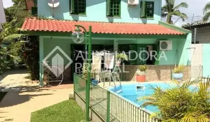 Casa em condomínio fechado com 4 quartos à venda na Rua Mura, 50, Guarujá, Porto Alegre, 297 m2 por R$ 750.000