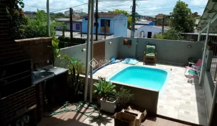 Casa com 3 quartos à venda na Gralhas, 131, Jardim Algarve, Alvorada, 113 m2 por R$ 310.000