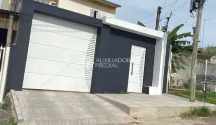 Casa com 5 quartos à venda na Rua Cento e Trinta e Cinco, 294, Jardim Algarve, Alvorada, 150 m2 por R$ 410.000