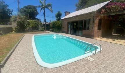 Casa com 3 quartos à venda na MAURA­CIO LESSA, 295, Flórida, Guaíba, 300 m2 por R$ 970.000