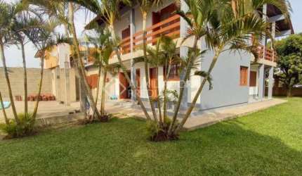 Casa em condomínio fechado com 4 quartos à venda na Avenida Maurício Lessa, 535, Flórida, Guaíba, 306 m2 por R$ 840.000