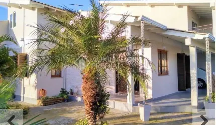 Casa em condomínio fechado com 3 quartos à venda na Rua Josué Guimarães, 695, Jardim dos Lagos, Guaíba, 170 m2 por R$ 580.000