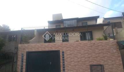 Casa em condomínio fechado com 3 quartos à venda na Rua Nova Araça, 67, Vila Augusta, Viamão, 190 m2 por R$ 500.000