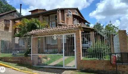 Casa em condomínio fechado com 4 quartos à venda na Rua Mogno, 24, Cantegril, Viamão, 190 m2 por R$ 550.000