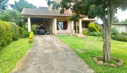 Casa em condomínio fechado com 3 quartos à venda na Rua Maximiliano José Bernardes, 244, Cecília, Viamão, 198 m2 por R$ 700.000