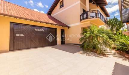 Casa em condomínio fechado com 3 quartos à venda na Rua Taurus, 198, Moinhos De Vento, Canoas, 350 m2 por R$ 1.598.000