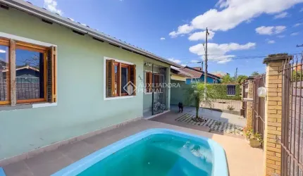 Casa com 3 quartos à venda na Rua Corujas, 437, Jardim Algarve, Alvorada, 120 m2 por R$ 305.000