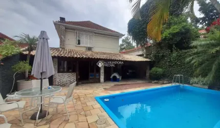Casa em condomínio fechado com 4 quartos à venda na Rua Camerino, 152, Petrópolis, Porto Alegre, 390 m2 por R$ 1.650.000