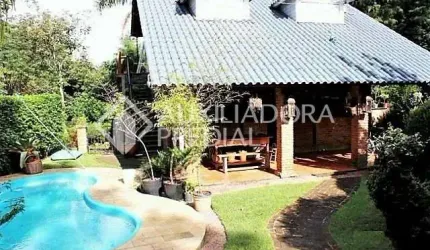Casa em condomínio fechado com 5 quartos à venda na Rua Pedro de Oliveira França, 572, Hípica, Porto Alegre, 270 m2 por R$ 1.200.000