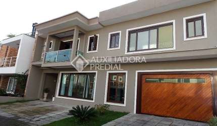 Casa em condomínio fechado com 3 quartos à venda na Rua Carlos Maximiliano Fayet, 80, Hípica, Porto Alegre, 305 m2 por R$ 1.100.000