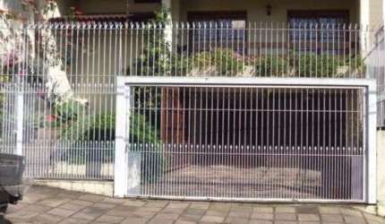 Casa em condomínio fechado com 3 quartos à venda na Rua João Bonuma, 48, Coronel Aparício Borges, Porto Alegre, 326 m2 por R$ 1.200.000