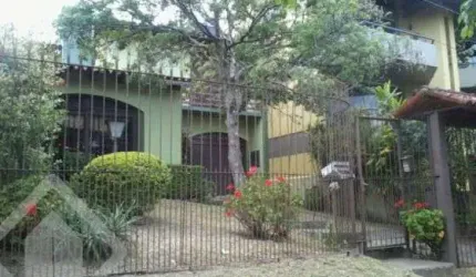 Casa em condomínio fechado com 4 quartos à venda na Rua Comandai, 560, Cristal, Porto Alegre, 300 m2 por R$ 850.000