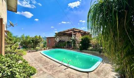 Casa com 4 quartos à venda na Rua Guilherme Vielitz, 467, Canudos, Novo Hamburgo, 220 m2 por R$ 585.000
