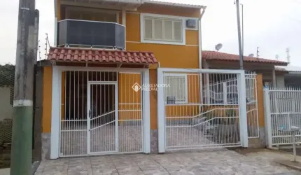 Casa com 3 quartos à venda na Rua Condores, 446, Jardim Algarve, Alvorada, 119 m2 por R$ 590.000