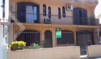 Casa em condomínio fechado com 4 quartos à venda na Rua Márcio Dias, 340, Nonoai, Porto Alegre, 450 m2 por R$ 700.000