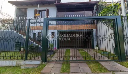 Casa com 3 quartos à venda na Rua Doutor Egydio Michaelsen, 250, Cavalhada, Porto Alegre, 292 m2 por R$ 960.000