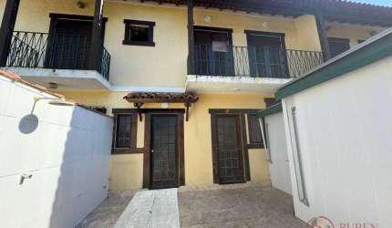 Village com 2 dormitórios à venda, 69 m² por R$ 690.000,00 - Centro - Bertioga/SP