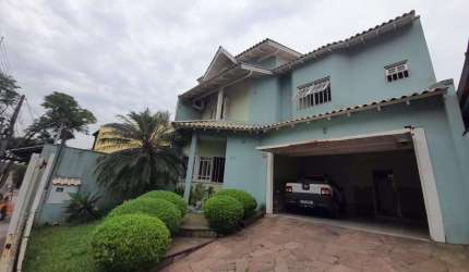 Casa com 3 quartos à venda na Rua da Amizade, 92, Estância Velha, Canoas, 197 m2 por R$ 745.000