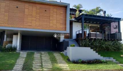Casa em condomínio fechado com 3 quartos à venda na DAS FLORES, 19, Morrinhos, Garopaba, 388 m2 por R$ 3.200.000